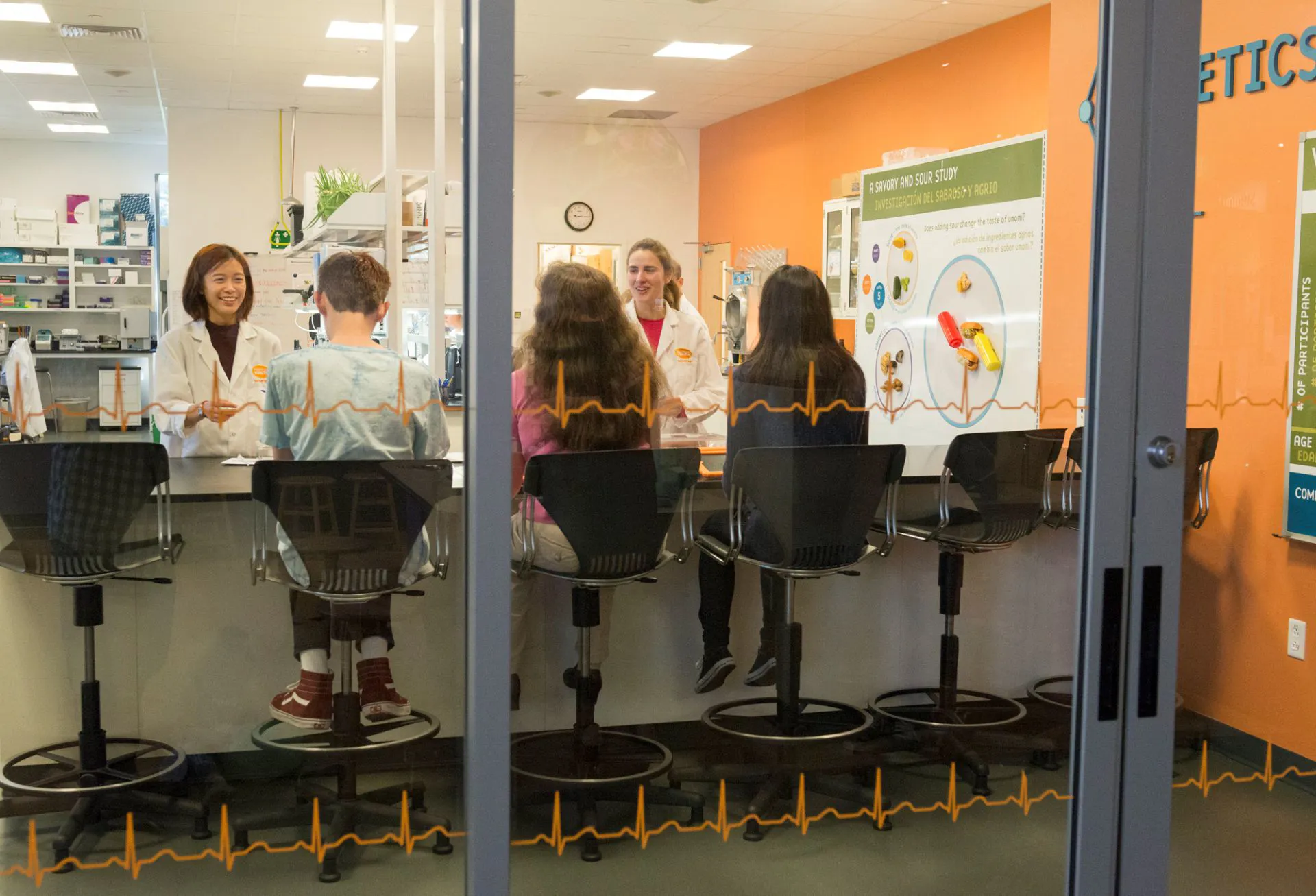 Guests and staff sitting inside lab