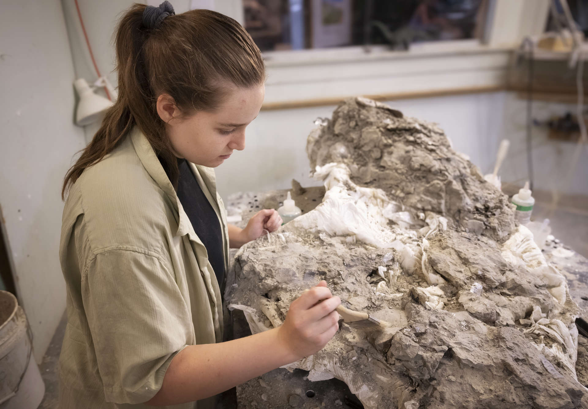 Intern prepping fossil
