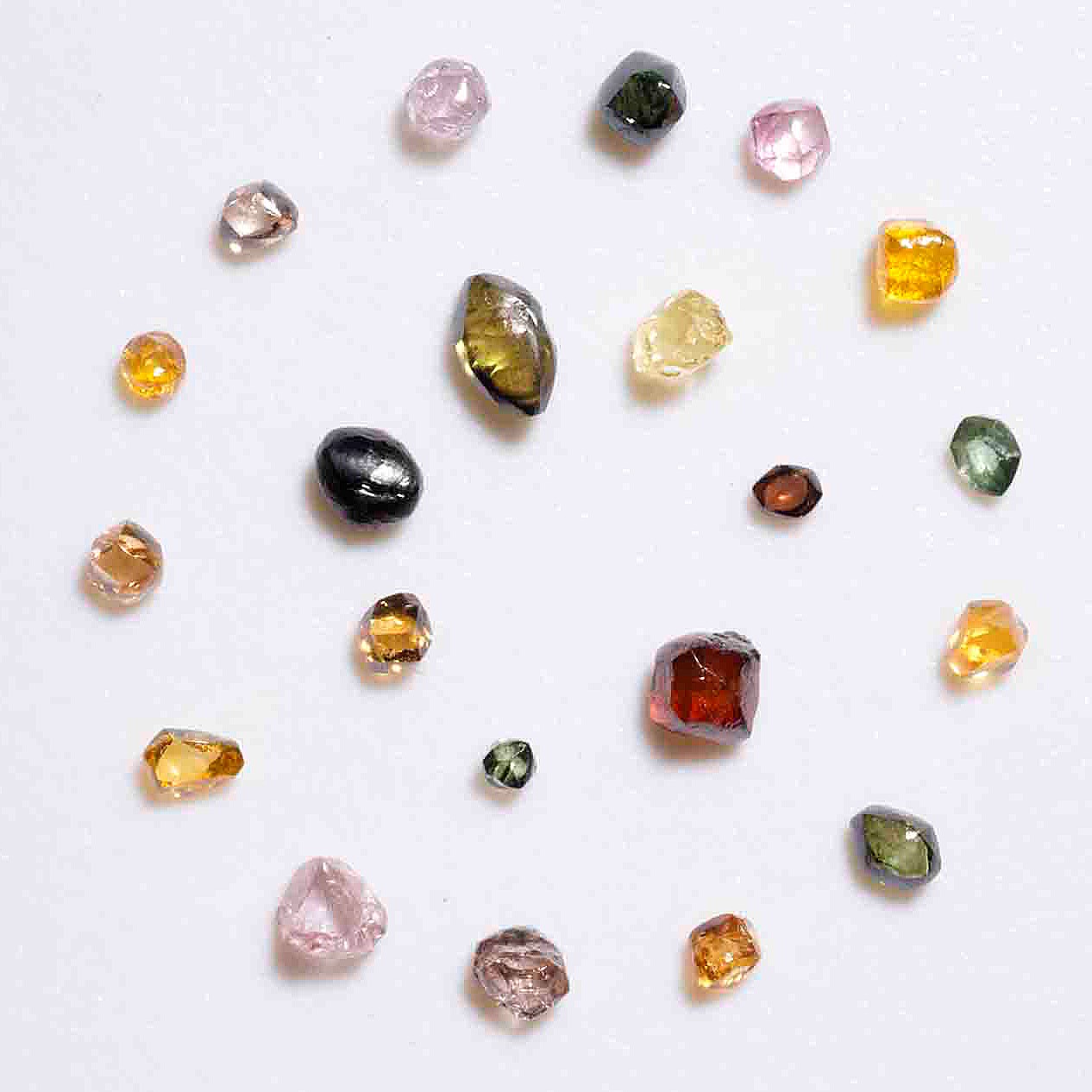 Fancy, or colored, diamonds from the Museum’s extensive micromount mineral collection. The colors are largely caused by chemical impurities and deformations in the diamonds’ internal crystal structure. (Photo/ Rick Wicker)